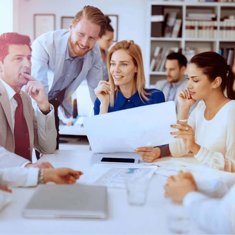insurance-agent-placing-hands-protectively-over-paper-model-of-businessman