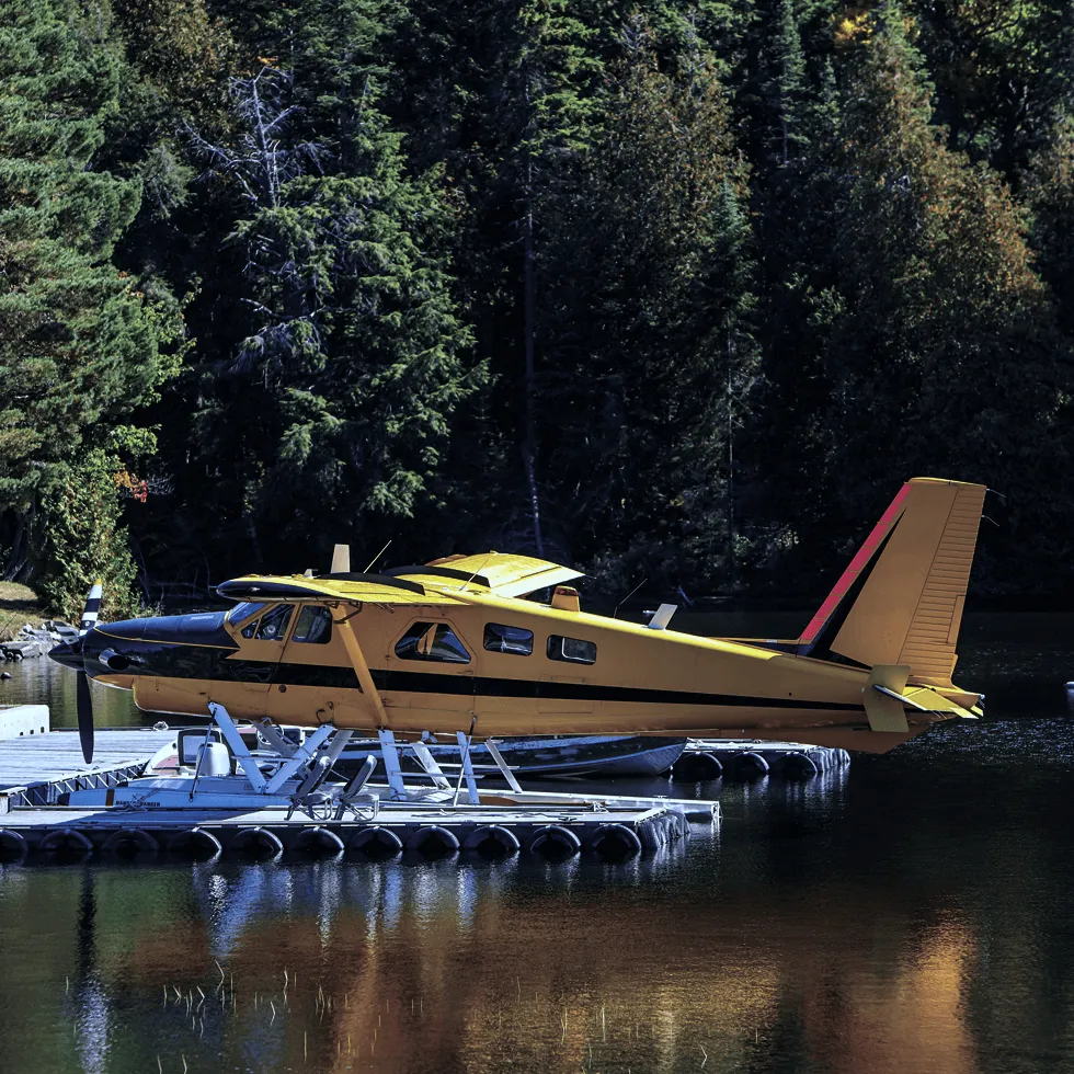 yellow-aircraft-on-water-at-pier